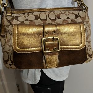 Like new metallic & suede buckle pkt coach bag